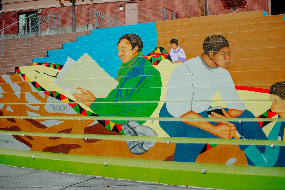 mural artist Dionne Bonner painting Black Lives Matter Mural